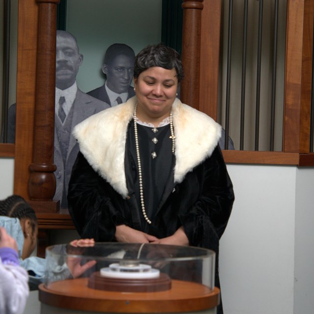 woman smiling while being filmed