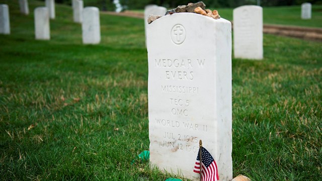 Medgar Evers gravestone with small American flag