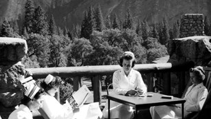 B&W photo of nurse and sailor sitting outside at Yosemite