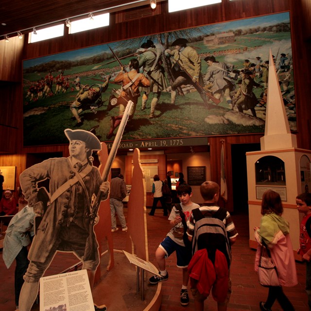 A group of students explore the interior of the Visitor Center