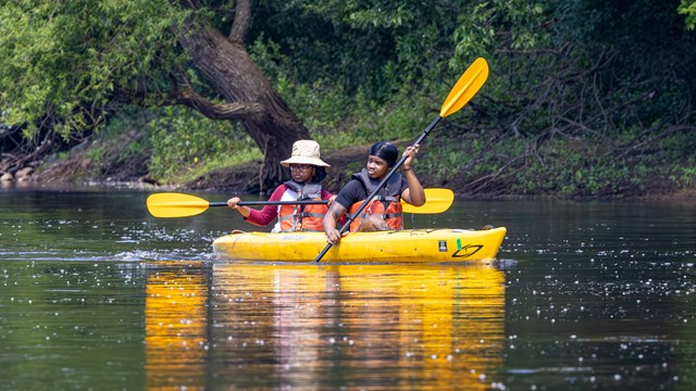 Two paddlers on the Mississippi River