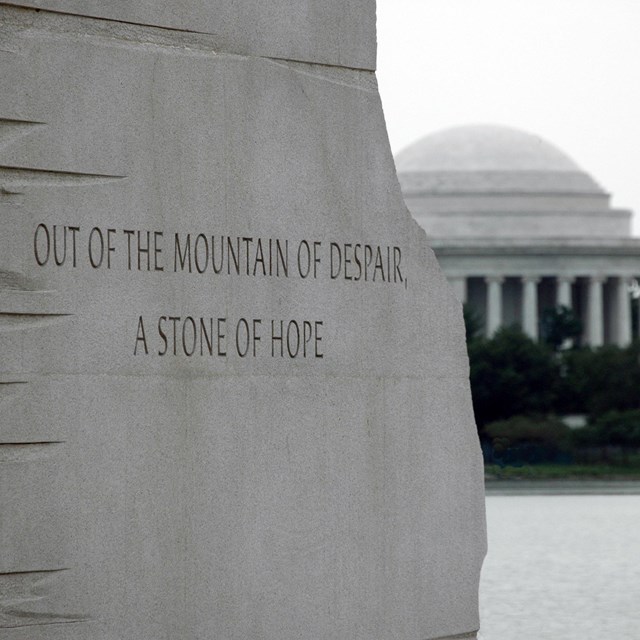 View of Jefferson Memorial between two stone walls of a memorial