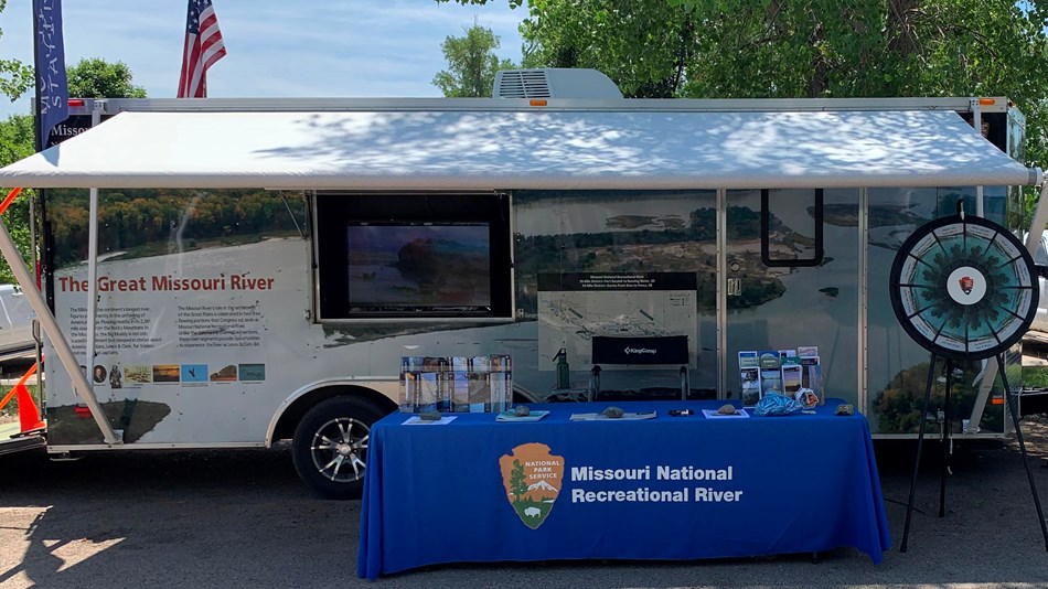 Mobile Ranger Station with table full of MNRR information and brochures. 