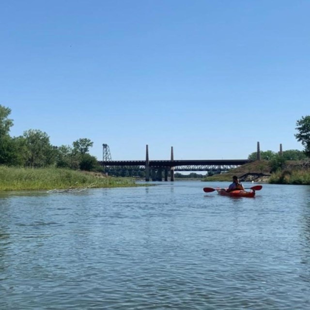 A ranger floats down the river near Green Island.  