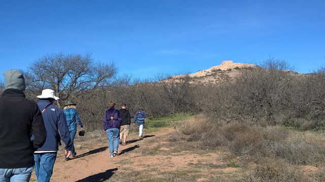 A group of people being lead on a tour.