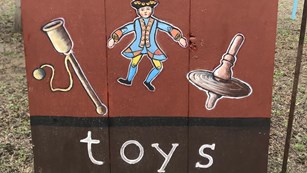 Colonial toy sign 