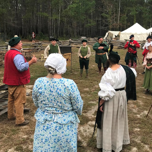 Volunteers and staff speaking