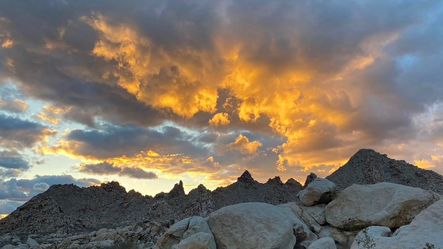 Mountains with orange clouds.