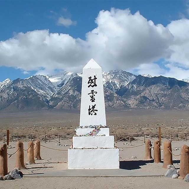 Manzanar cemetery monument with snowy mountains in background