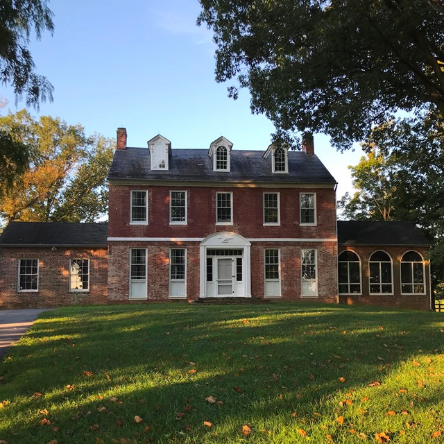Three-story brick farm house
