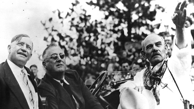 President Franklin D. Roosevelt (middle) next to Gutzon Borglum (far right) at the 1936 unveiling of