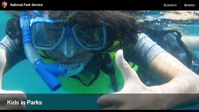 Website screenshot of a young person snorkeling.