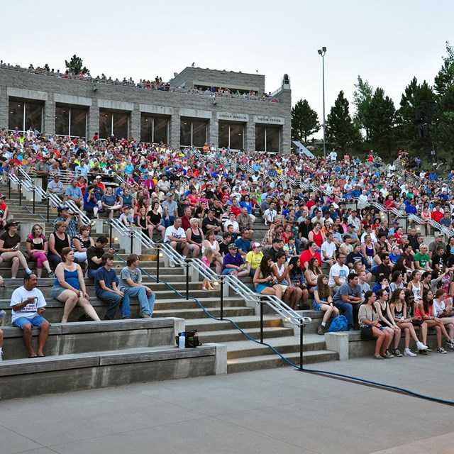 Photo of the audience gathered in the amphitheater at Mount Rushmore.