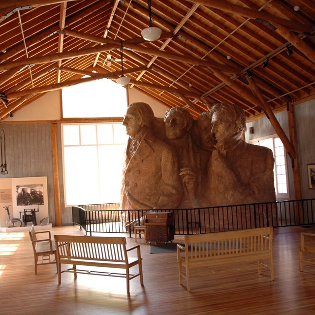 Photo of the interior of the Sculptor's Studio, with the scale model to the right.