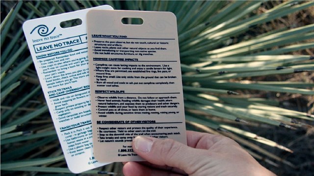 Hand holding cards describing Leave No Trace Principles