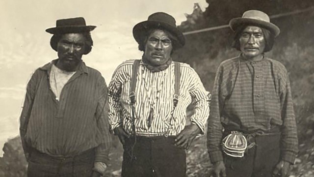 First known photo of Chief Charley, center. Taken on the Yukon River in 1882. Charles Farciot