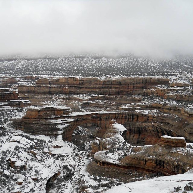 Sipapu natural bridge and surrounding landscape covered in snow