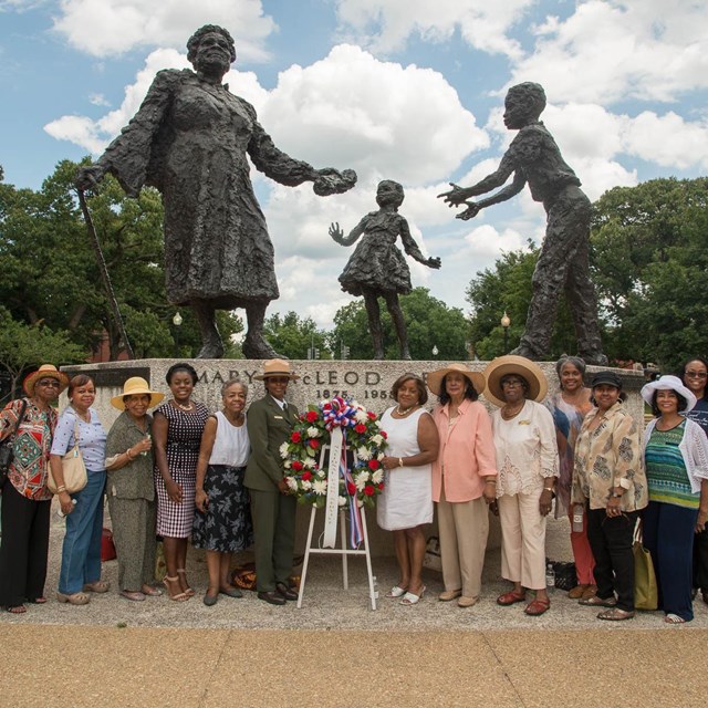 National Capitol Parks-East Superintendent and visitors lay wreath at Mary McLeod Bethune statue