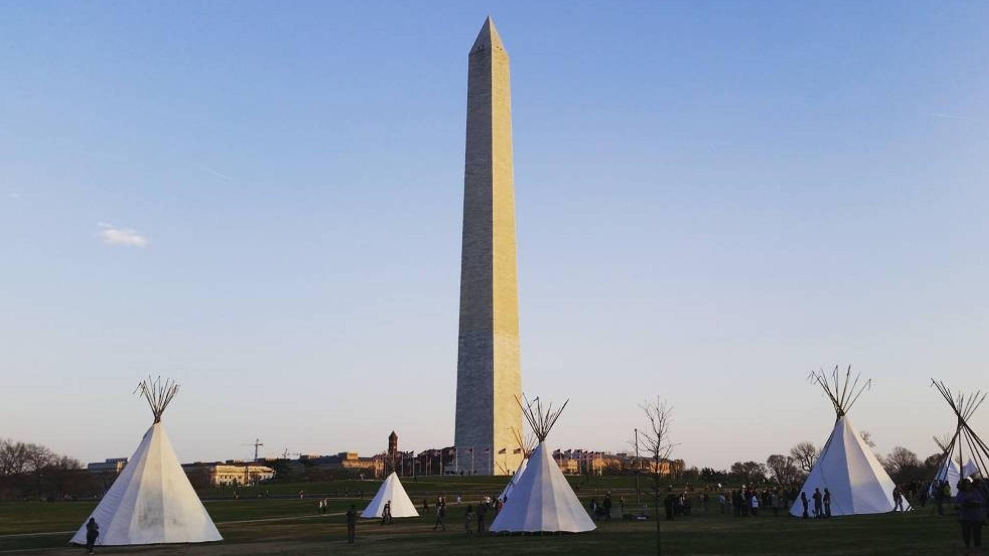 Tipis with the Washington Monument in the background