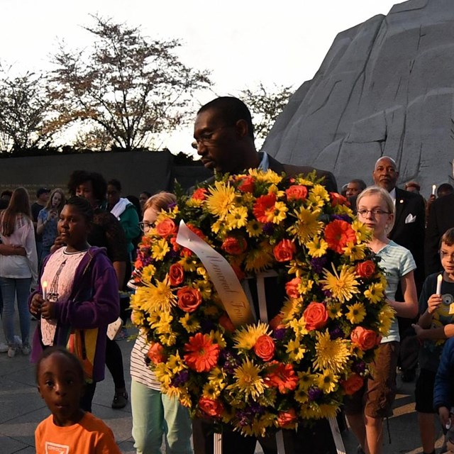 People carrying a wreath near the Martin Luther King, Jr. Memorial