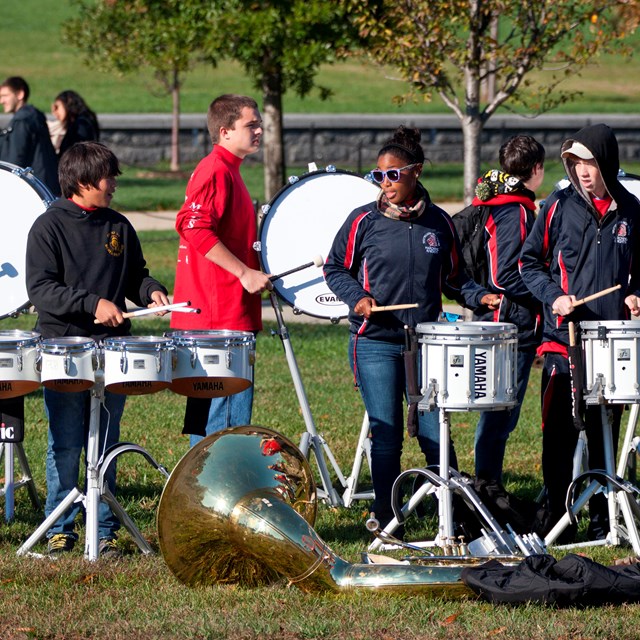 Youth band drum line in a park