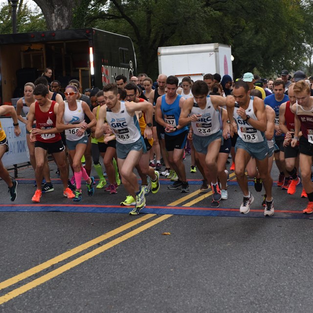 Runners at a race start line 