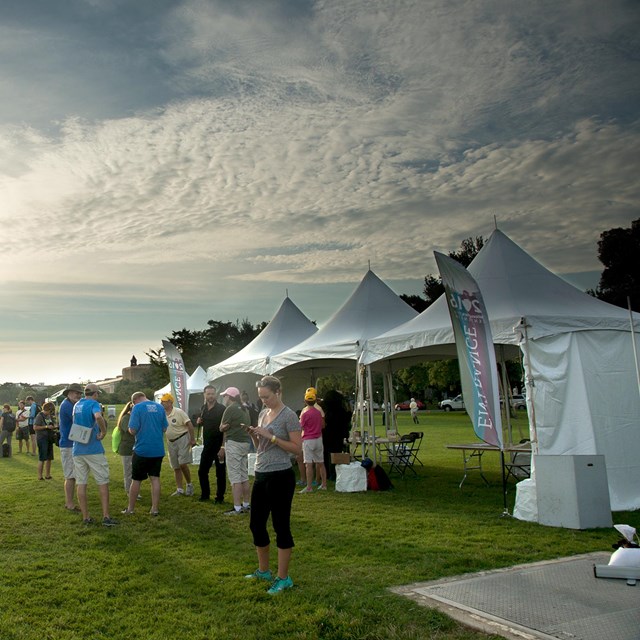 Visitors near event tents near the Washington Monument