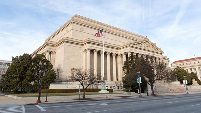 Gray stone National Archives Building, looking northeast