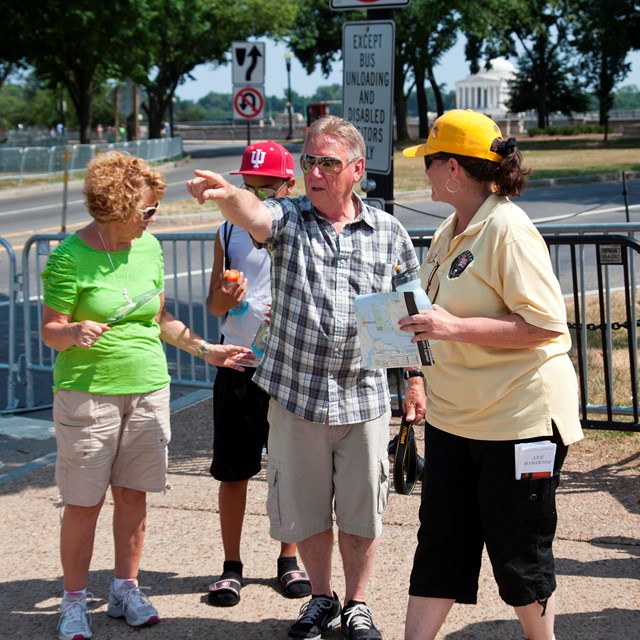 Volunteers aid guests and direct traffic on where to go.