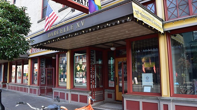 street front entrance with overhanging marquee reading "Darcelle XV"