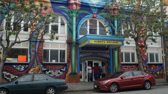 Building with awning reading "Women's Building" 