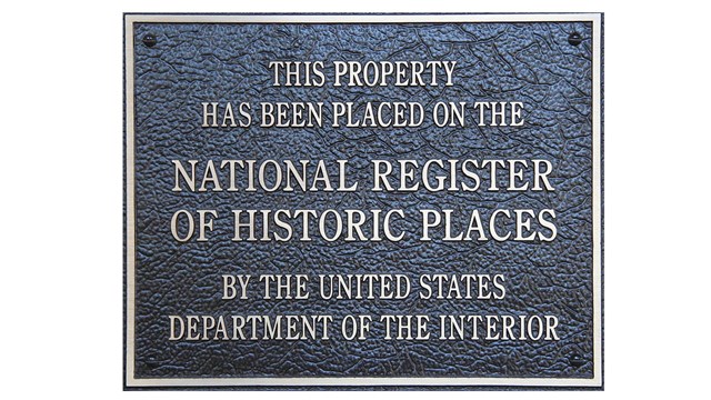 Plaque stating "This property has been placed on the National Register of Historic Places"