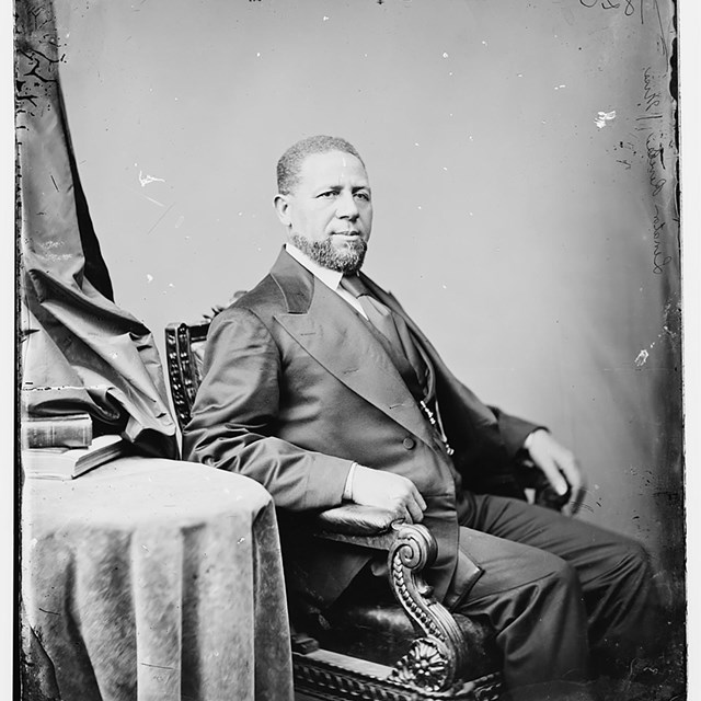 A formal portrait of an African American man circa 1870. 