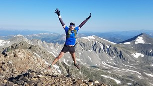 Hiker jumps in the air