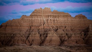 Close up of the badlands in South Dakota with a blue and purple sunset sky
