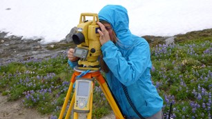 intern surveying the Nisqually Glacier at Mount Rainier National Park, Washington