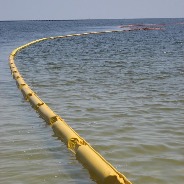 A boom is deployed during spill response on the ocean.