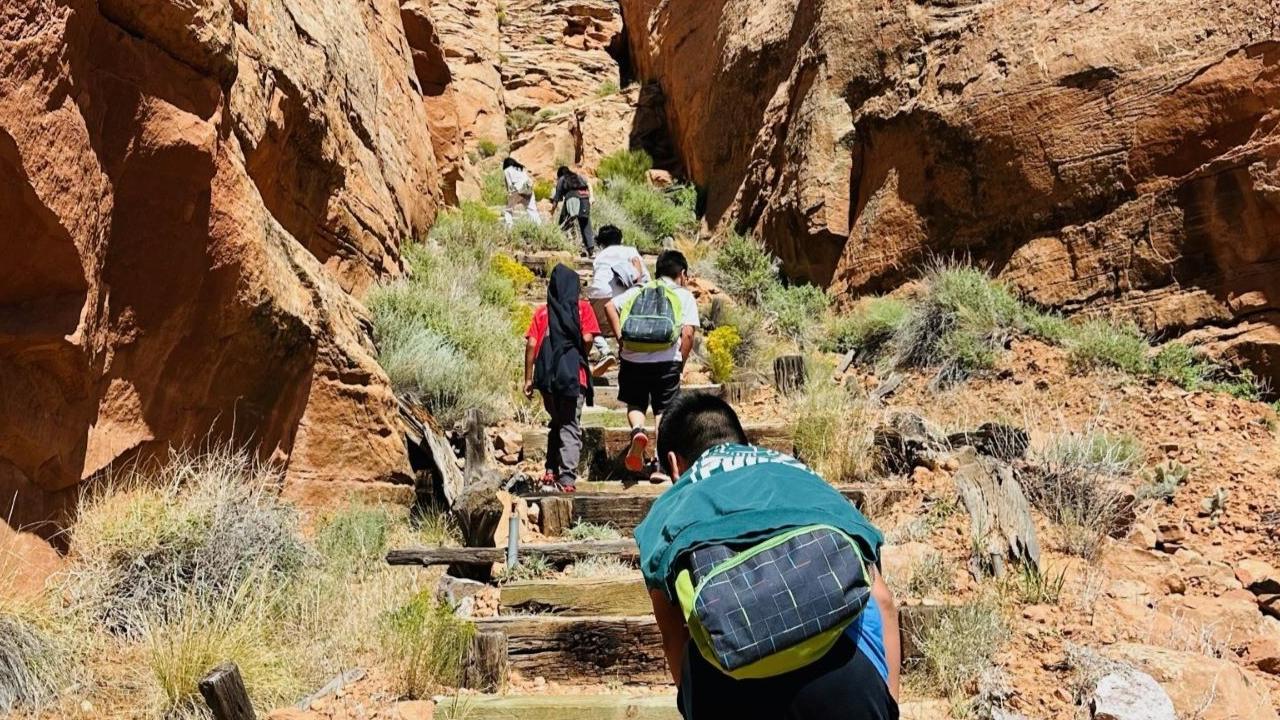 Junior Rangers hiking up a steep trail