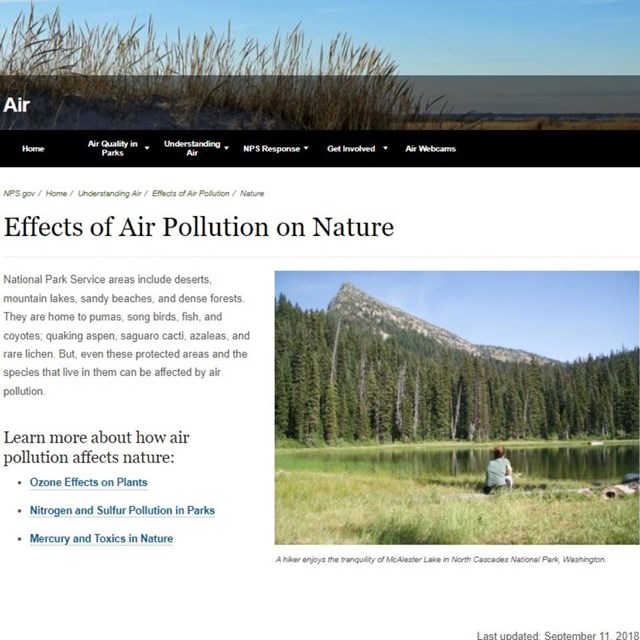 Screenshot of webpage with NPS banner, text, and photo of hiker sitting on grass by tree-lined lake