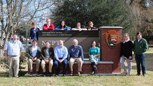Staff in front of Leo H Nelson Hall