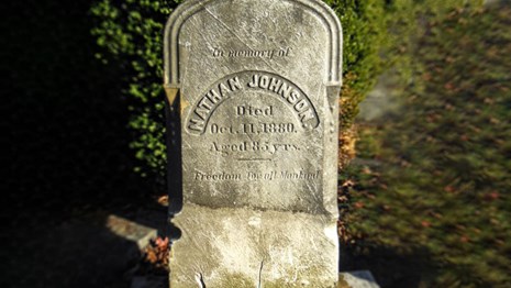 Close up photo of Nathan Johnsons headstone.