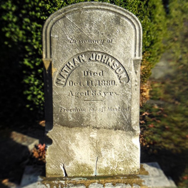 Close up photo of Nathan Johnsons headstone.