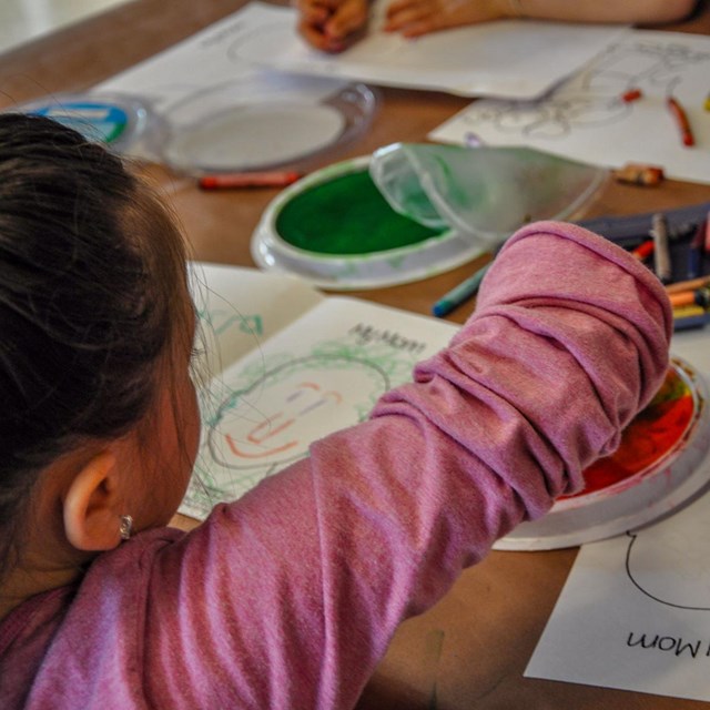 Young girl creating crafts