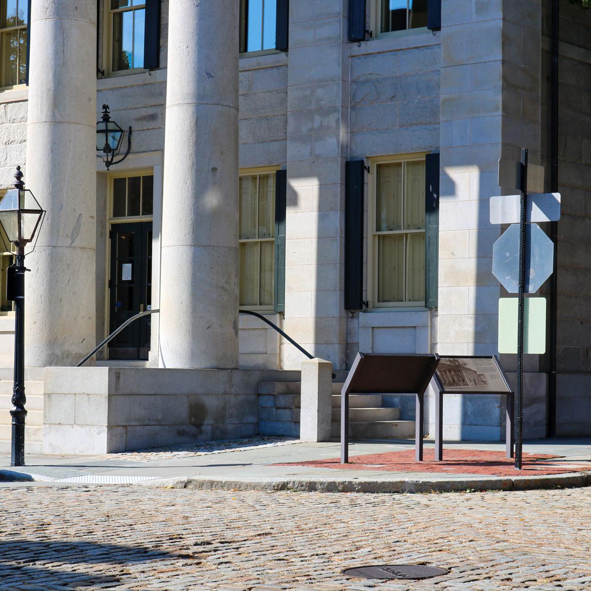 Front entrance of the U.S. Custom House, a historic stone building in downtown New Bedford.