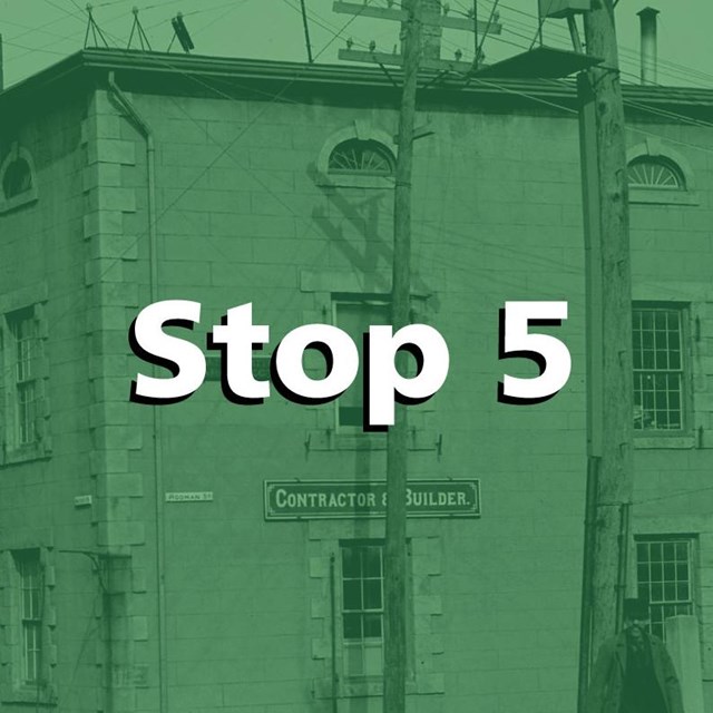 Green tint over a historic image of the rodman candleworks building