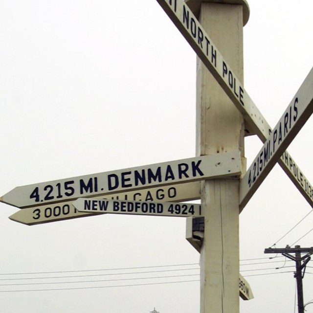 A navigation post in Barrow, Alaska points the way to New Bedford, Massachusetts.