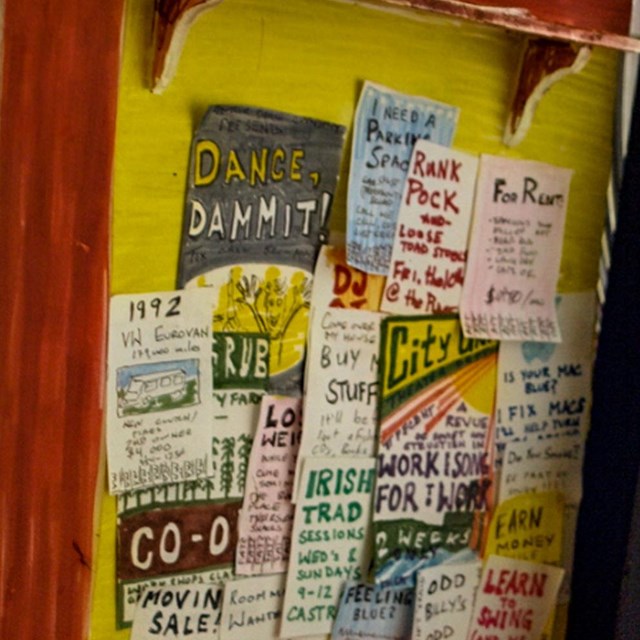  collection of posters on yellow wall