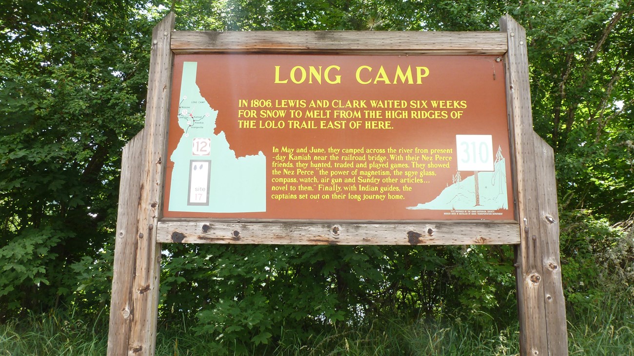 Wooden historical marker with information about Long Camp.