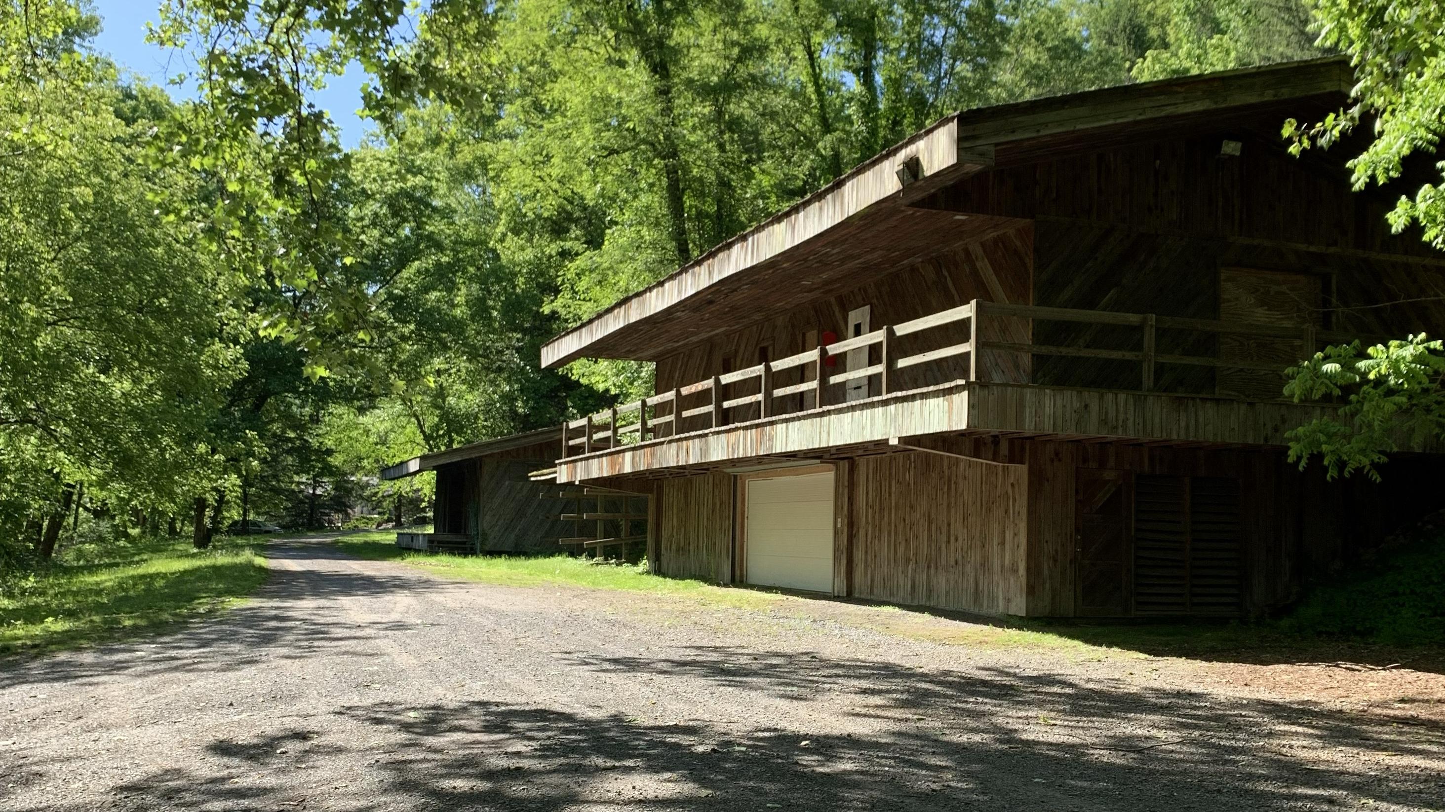 old two story wood building with big second floor deck