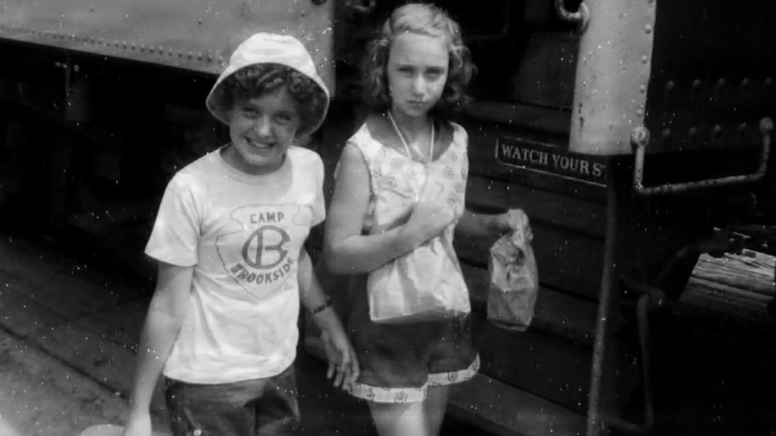 girls boarding train for summer camp